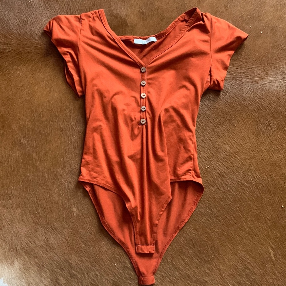 Orange one piece short sleeve shirt
